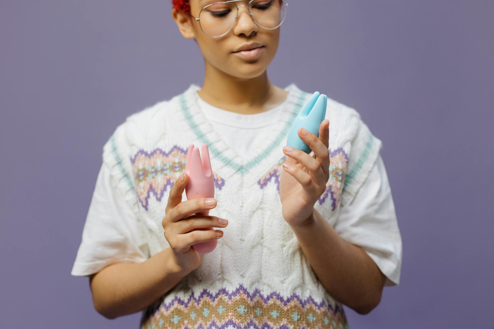 Woman holding lemon clitoral vibrators in contemplative moment, showing vulnerability and self-care